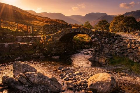 High Sweden Bridge, a single-arch stone packhorse bridge over Scandale Beck, at sunset
